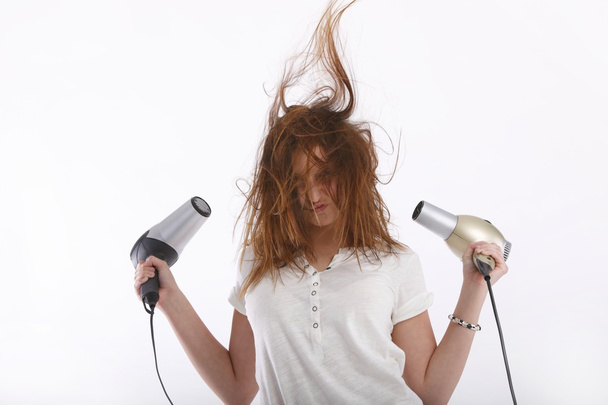 Girl with hair dryers in the hands of - Foto, afbeelding
