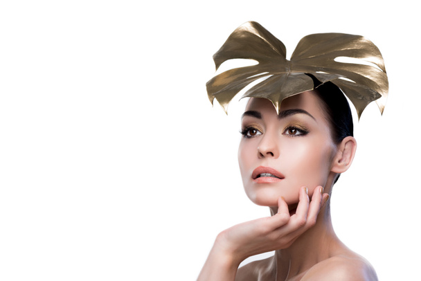 woman with golden leaf on head - Foto, imagen