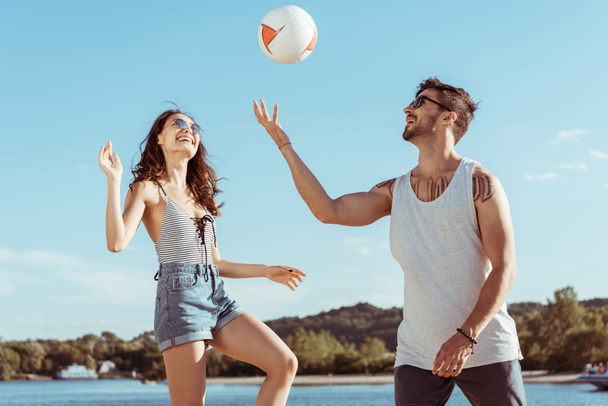 couple playing volleyball together - Photo, Image