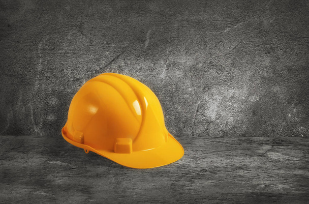 Construction helmet on concrete background - Photo, Image