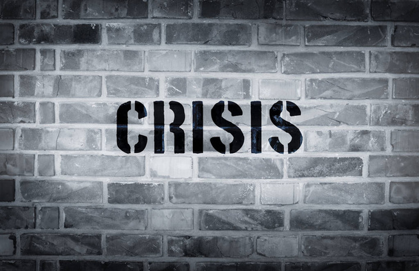 Crisis stencil print on the grunge white brick wall - Foto, immagini