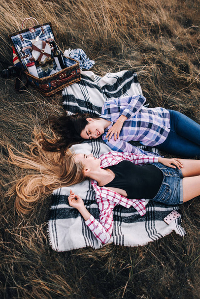 Beautiful girls on picnic in mountains - Fotoğraf, Görsel
