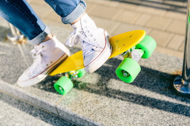 Girl with penny skateboard shortboard. - Foto, Imagen
