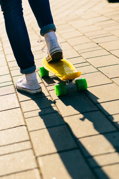 Girl with penny skateboard shortboard. - Φωτογραφία, εικόνα