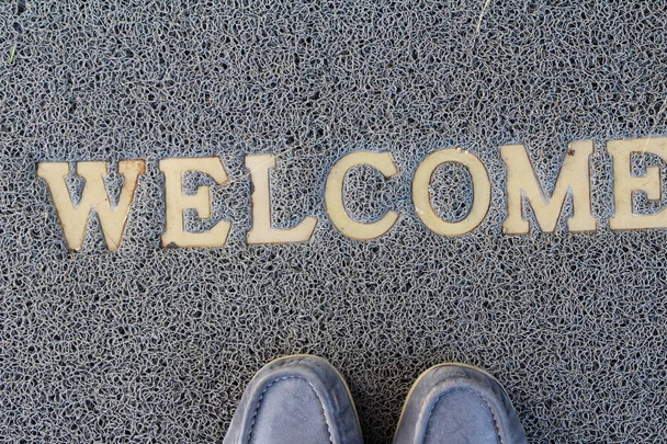 Welcome door mat on background and texture - Photo, Image