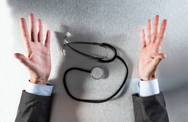 exasperated doctor hands with stethoscope talking about medicine, flat lay - Foto, Imagem