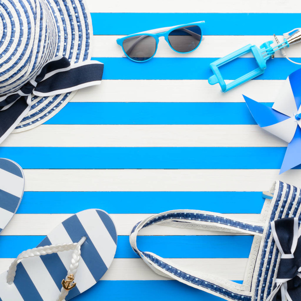Beach accessories on a blue and white background. Top view, flat lay. - Photo, Image