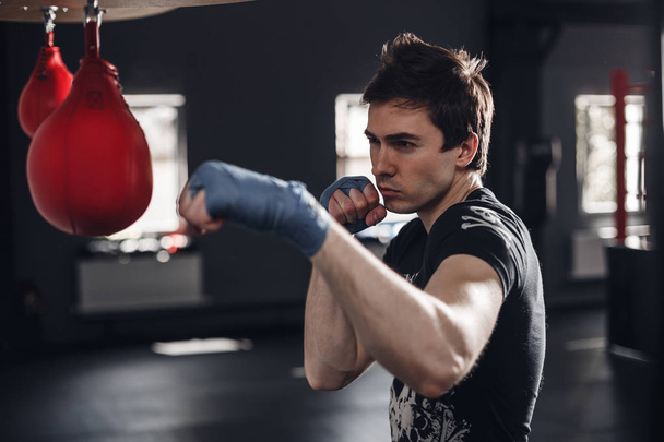 Young man boxing workout in a fitness club - Foto, imagen