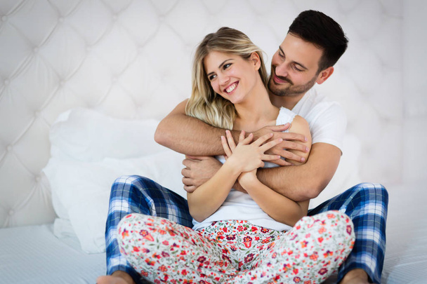 Couple Relaxing Together In Bed - Photo, image