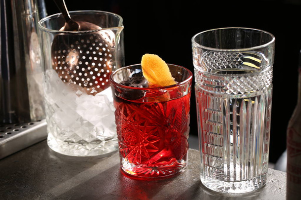 Negroni among two glasses. Close up - 写真・画像