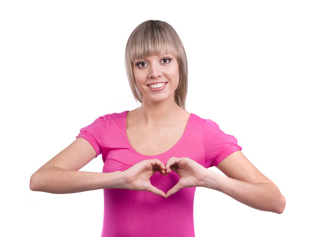 Woman doing a heart symbol with her hand - Foto, immagini