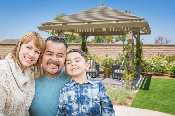 Mixed Race Family In Back Yard Near Patio Cover. - Photo, Image