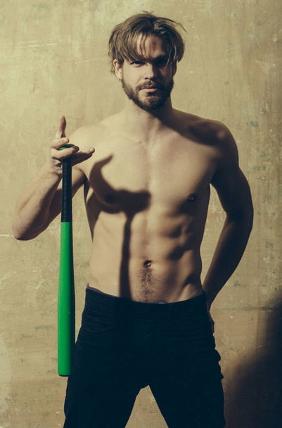 man with athletic torso holding baseball bat in hand - Fotografie, Obrázek