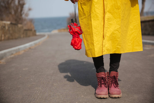 Shot of umbrella and woman legs - Фото, изображение
