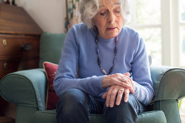 Senior Woman Suffering With Parkinsons Diesease - Фото, изображение
