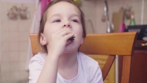Little girl eating cheese and cookies - Felvétel, videó
