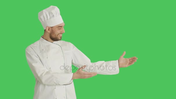 Mid Shot of a Handsome Chef making Presenting Gesture. Background is Green Screen. - Video, Çekim