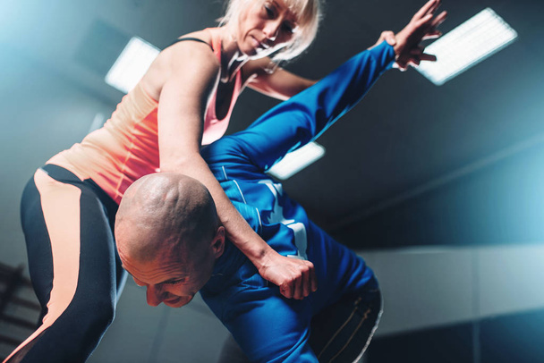 self-defense workout with personal trainer - Photo, image