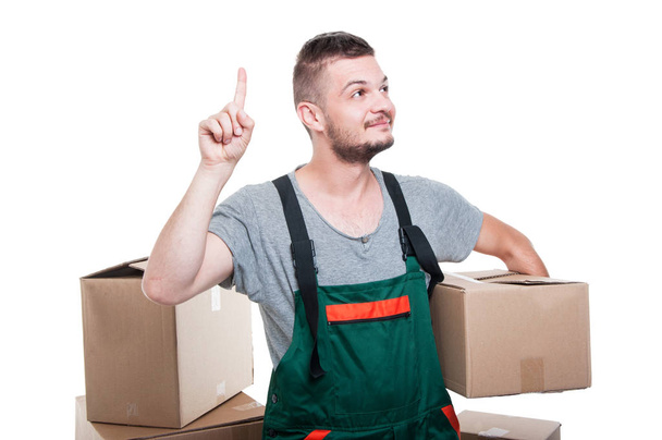 Mover guy holding cardboard box gesturing idea - Photo, Image