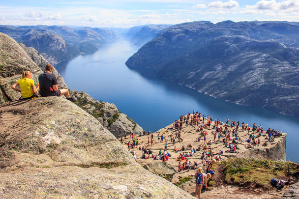 Majestic Panoramic summer view of the world famous Preikestolen (Preacher's Pulpit or Pulpit Rock), Forsand, Rogaland, Stavanger, Norway. Stunning and picturesque Lysefjord and nature as a background. - Фото, изображение