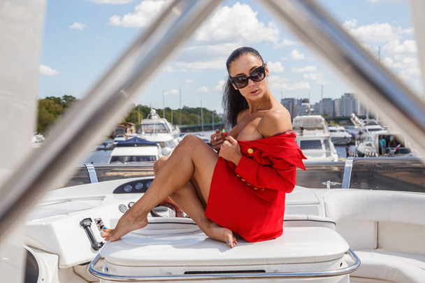young woman posing on yacht - Fotó, kép