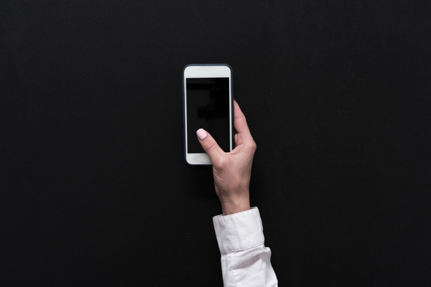 Mão segurando smartphone com tela em branco - Foto, Imagem