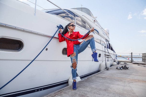  young woman posing near yacht   - 写真・画像