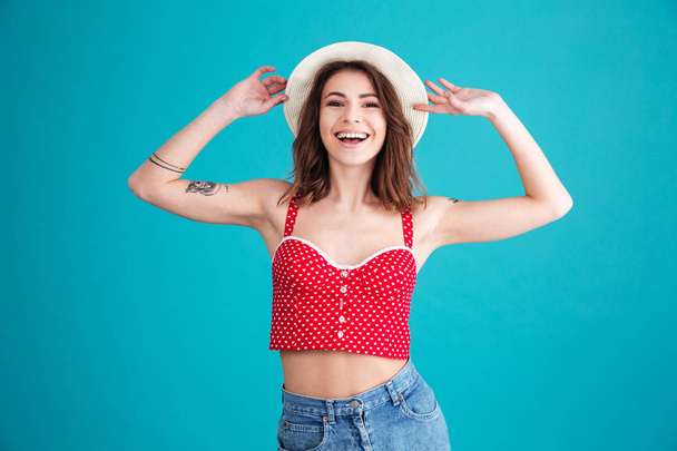 Portrait of a pretty smiling girl wearing hat - Фото, изображение