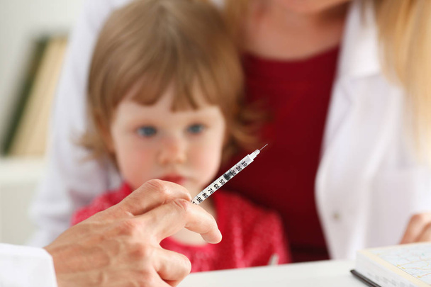 Little scared child at doctor reception make insulin shot - Photo, Image