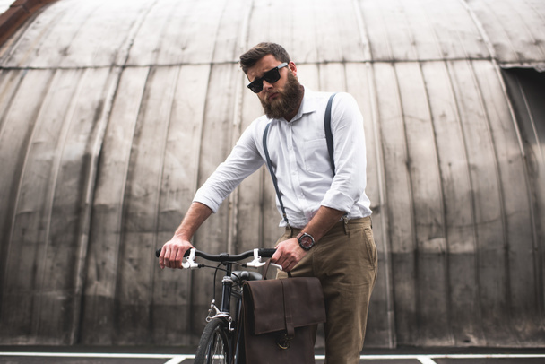 stylish man standing with bicycle - Fotoğraf, Görsel