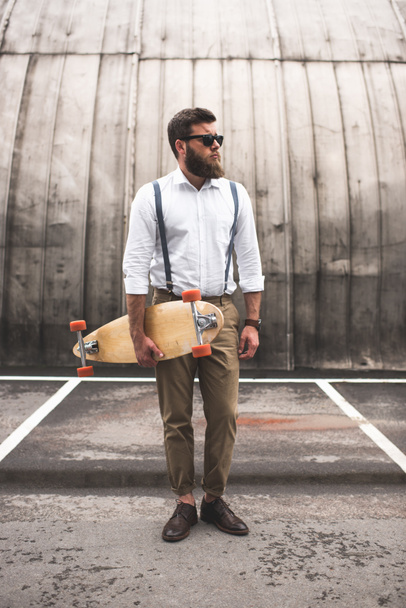 stylish man with longboard - Foto, Imagem