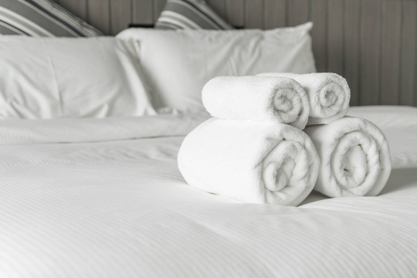 White towel on bed decoration in bedroom interior  - Fotoğraf, Görsel