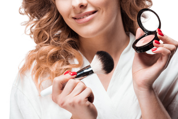 Woman applying makeup  - Photo, Image