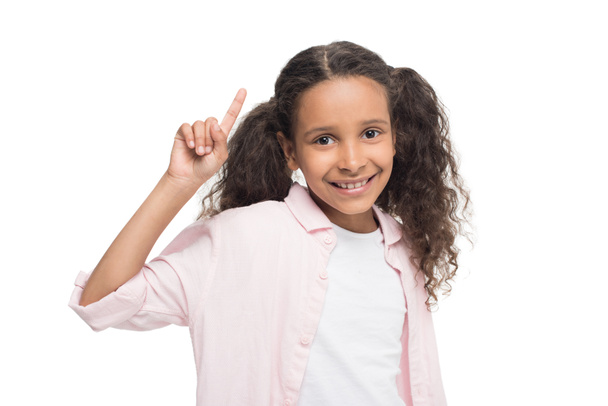 Girl pointing up with finger  - Φωτογραφία, εικόνα