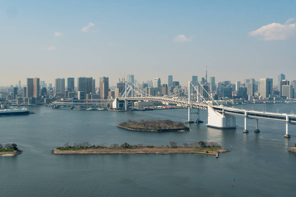 Tokyo Bay with a view of the Tokyo skyline and Rainbow Bridge in - Photo, Image