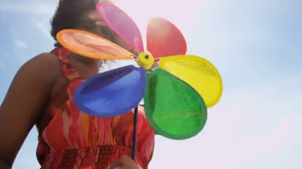 woman having fun with pinwheel  - Metraje, vídeo