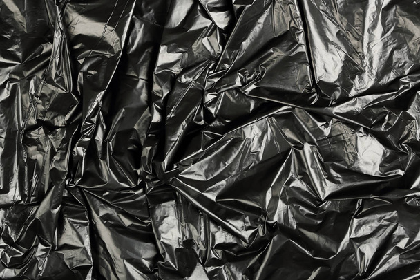 crumpled black plastic  - Photo, Image