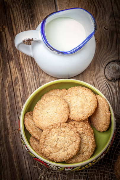 Stack of freshly baked oat biscuits in a bowl. - Photo, Image