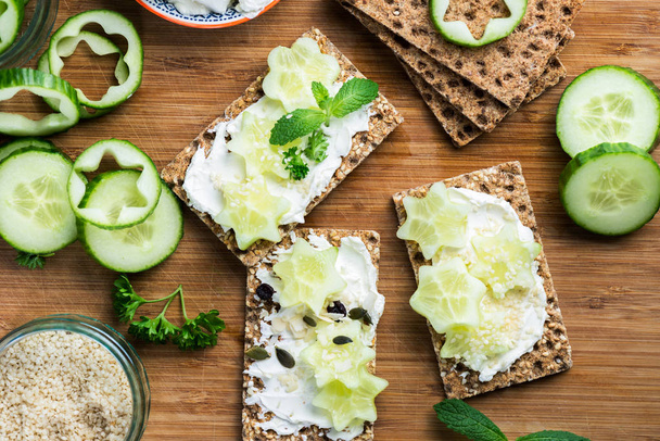 Snack from Wholegrain Rye Crispbread Crackers and Cucumber - Photo, Image