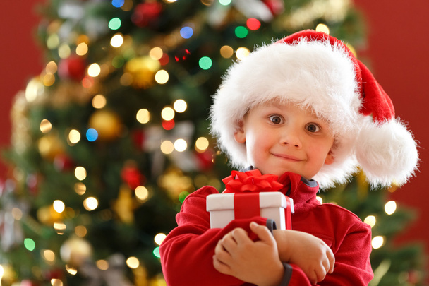 Boy with Christmas gift - Foto, afbeelding