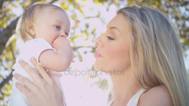 mother kissing baby boy - Footage, Video