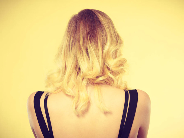 Blonde woman back with black dress straps - Foto, imagen