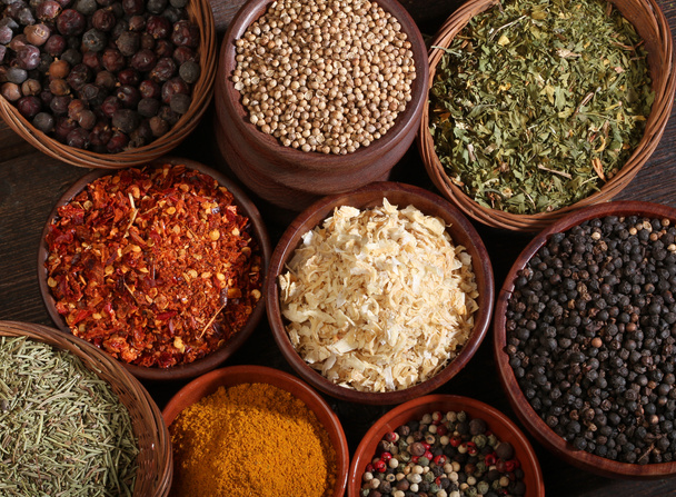 Different spices over a wood background. - Photo, Image