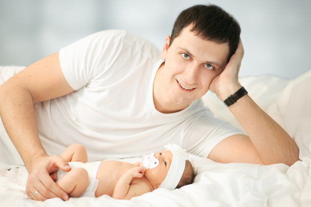 Young father and newborn baby boy - 写真・画像