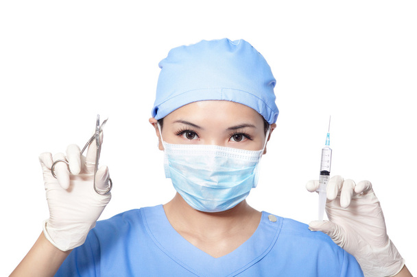 Surgeon woman holding syringe and clippers - Valokuva, kuva