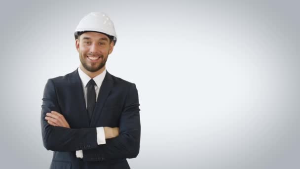 Mid Shot of a Businessman Wearing Hard Hat, smiling and Crossing His Hands. Shot Made on a White Background. - Πλάνα, βίντεο