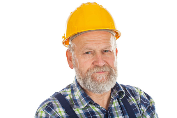 Elderly builder holding utensils - Φωτογραφία, εικόνα