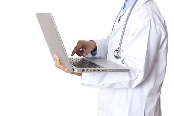 Doctor holding and using laptop computer. - Фото, изображение