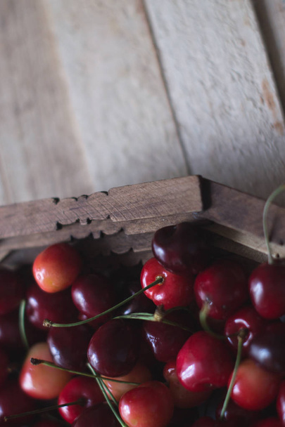 Cherry berries are fresh on a wooden background. Concept of health. - Foto, Imagen