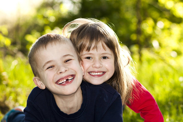 Portrait of happy smiling little children boy and girl on sunny  - Foto, Imagem